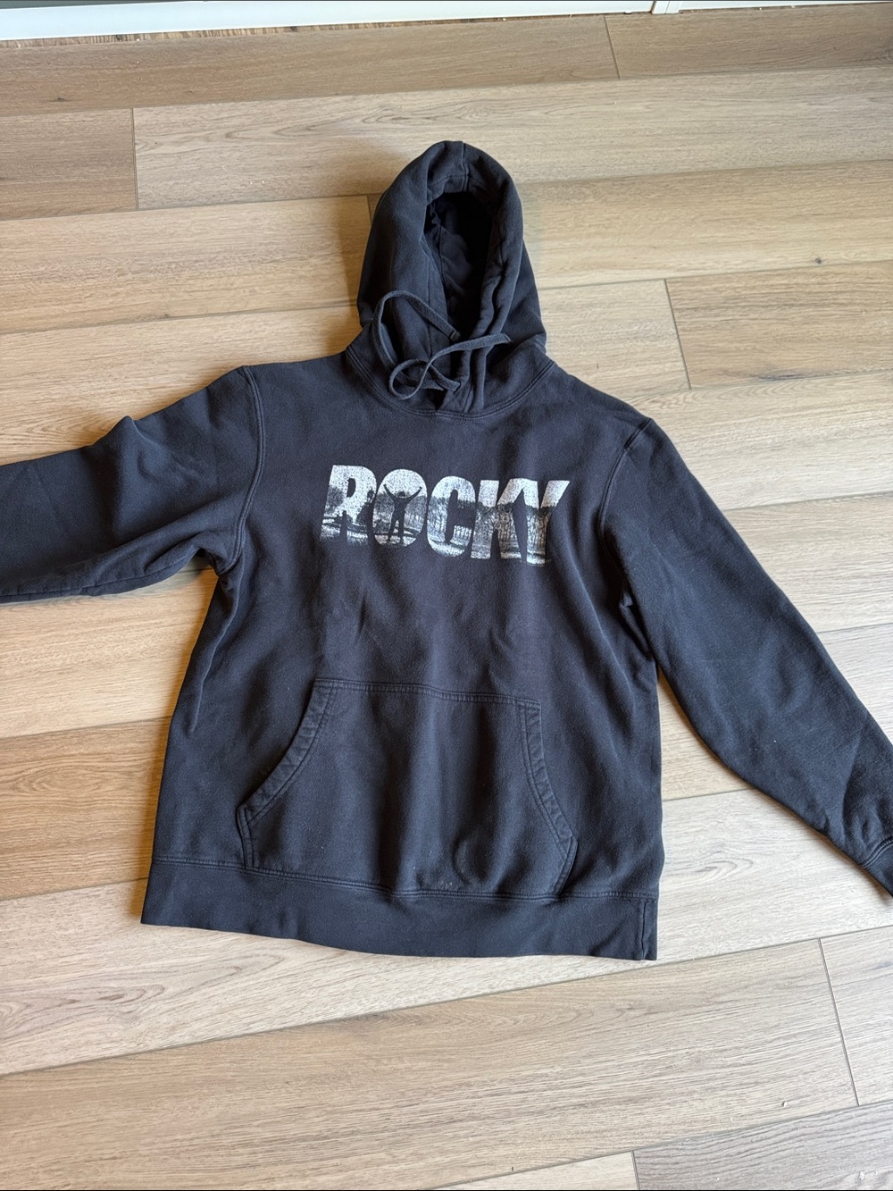 Rocky Black Pullover Hoodie with Distressed White Logo